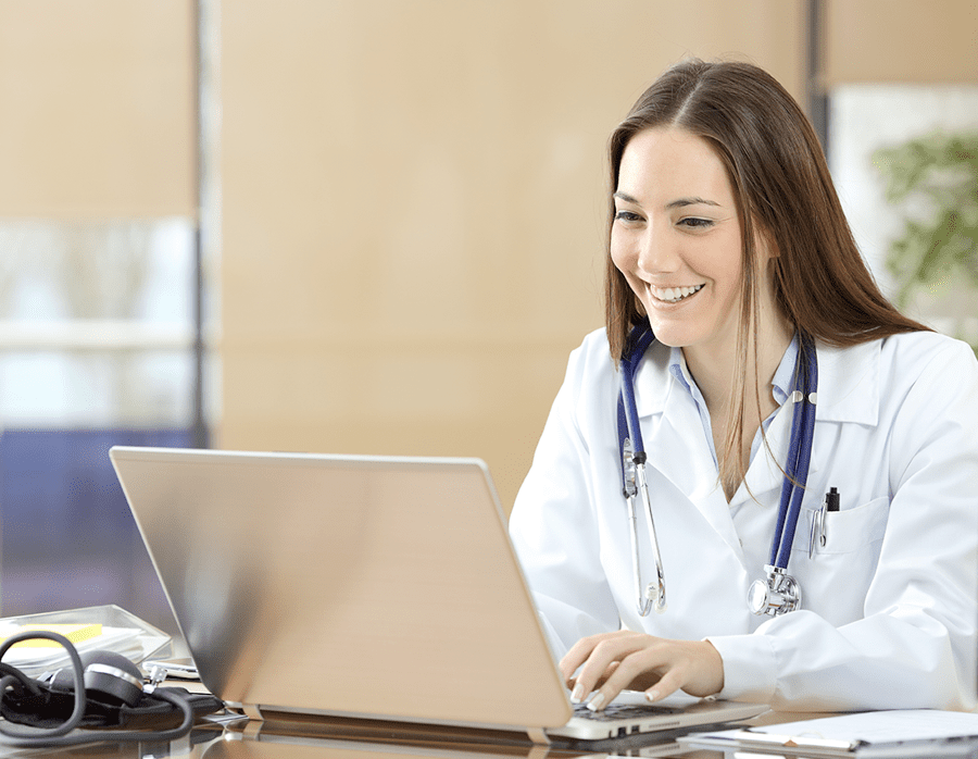 Medical networking Medical professional with stethoscope on laptop